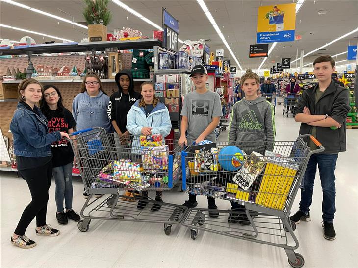 W.C. Friday Middle band students collected $725 and purchased Christmas gifts for children at Levine Children’s Hospital.